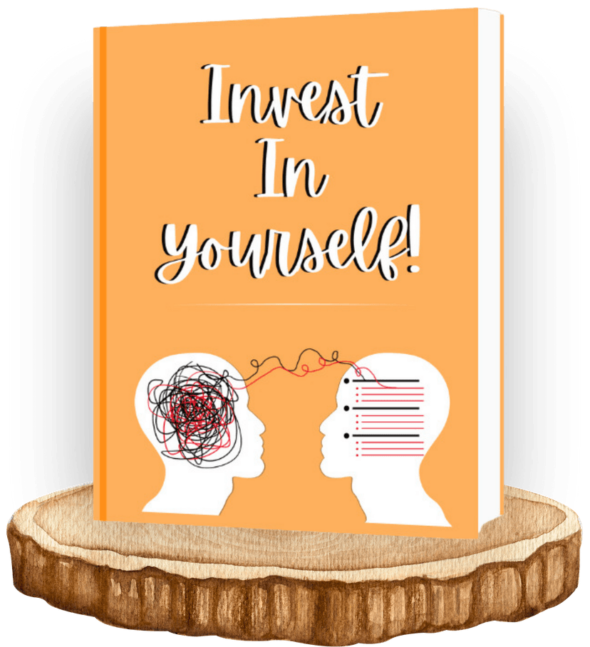 Image of an Invest in Yourself Journal created by Aswini Bajaj placed on top of a wooden base